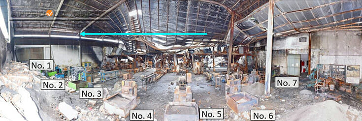 Photograph 2: Panoramic view of the arrangement of seven (7) extrusion machines in the West Section that shows the fire spread from the south to north (blue arrow), photographed from the west.